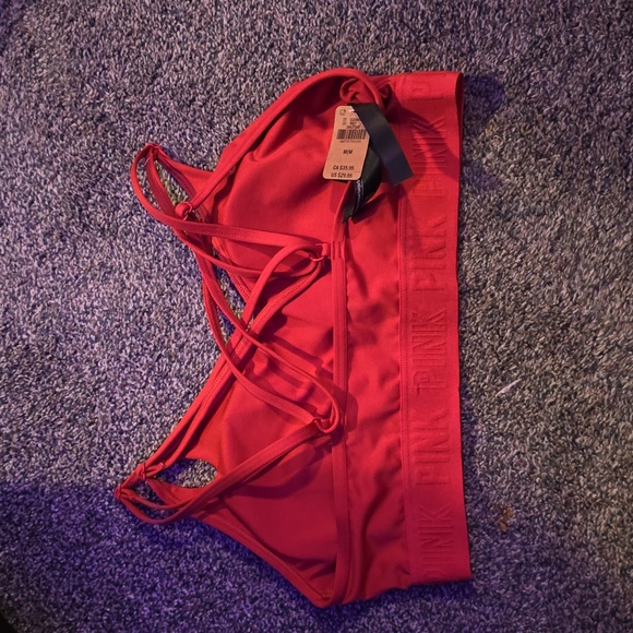 Pink sports bra.  Not sure if you would call it orange or red - Picture 2 of 2